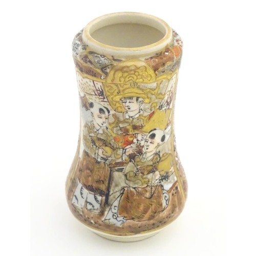 63 - A Japanese satsuma vase with panelled decoration depicting figures. Character marks under. Approx. 3... 