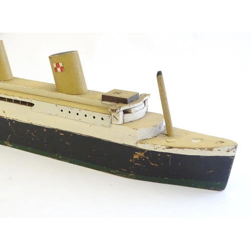 1308 - Toys: An early 20thC scratch built steam ship / boat with two funnels and green hull, possibly model... 