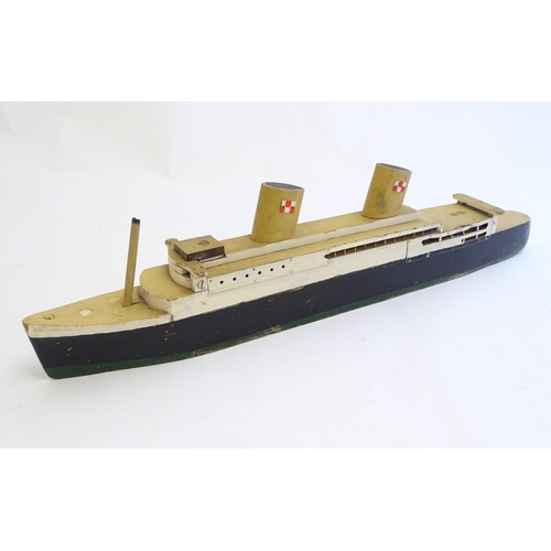 1308 - Toys: An early 20thC scratch built steam ship / boat with two funnels and green hull, possibly model... 