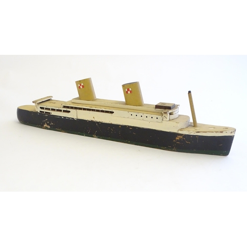 1308 - Toys: An early 20thC scratch built steam ship / boat with two funnels and green hull, possibly model... 