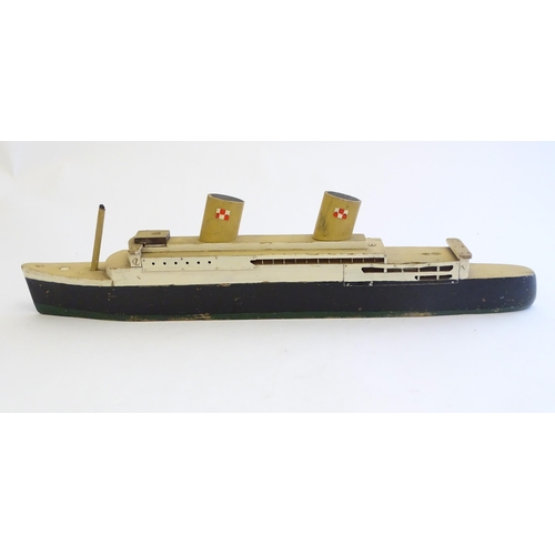 1308 - Toys: An early 20thC scratch built steam ship / boat with two funnels and green hull, possibly model... 