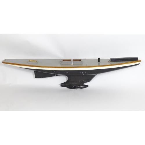 1319 - Toy: A 20thC scratch built wooden model of a boat with polychrome decoration. Approx. 60