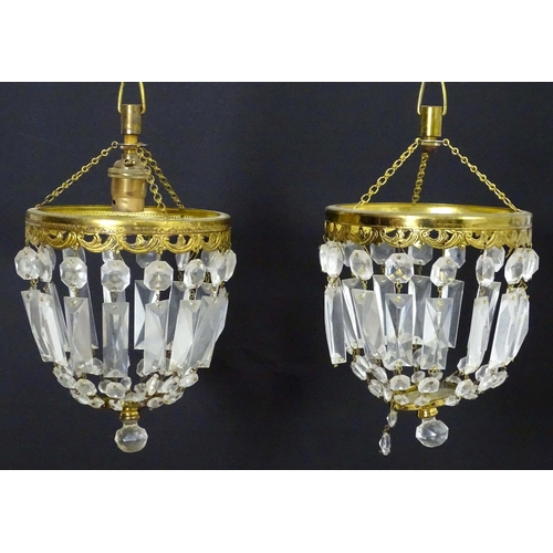 1334 - A pair of 20thC pendant bag chandeliers, the cut glass droplets suspended from gilt mounts. 6