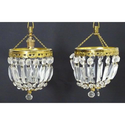 1334 - A pair of 20thC pendant bag chandeliers, the cut glass droplets suspended from gilt mounts. 6