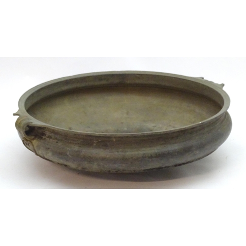 1352 - A 19thC large bronze basin / planter of circular form with twin handles and relief stylised heart de... 