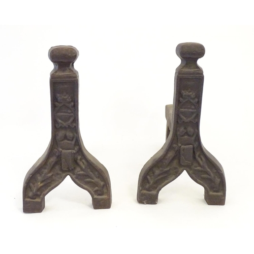 1359 - A pair of 19thC cast iron fire dogs / andirons with foliate and cartouche detail. Approx. 16 1/4