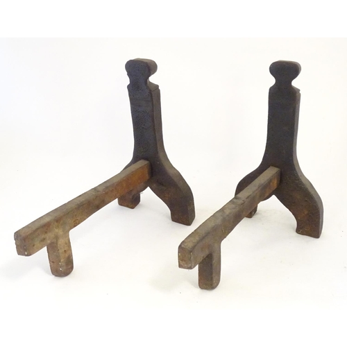 1359 - A pair of 19thC cast iron fire dogs / andirons with foliate and cartouche detail. Approx. 16 1/4