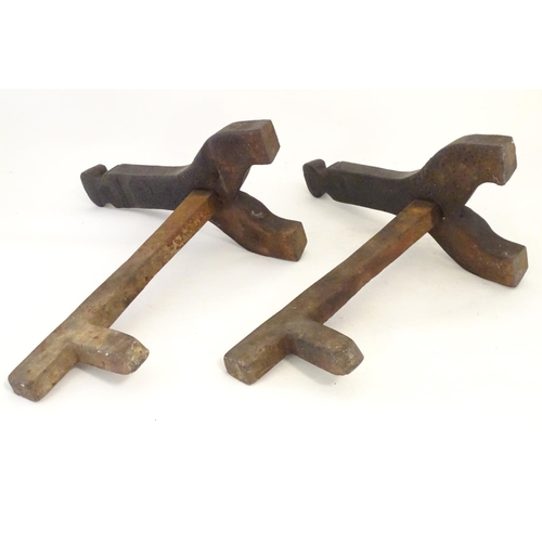 1359 - A pair of 19thC cast iron fire dogs / andirons with foliate and cartouche detail. Approx. 16 1/4