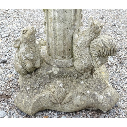 1370 - Garden & Architectural, Salvage: a pair of 20thC reconstituted stone statues formed as cherubs atop ... 