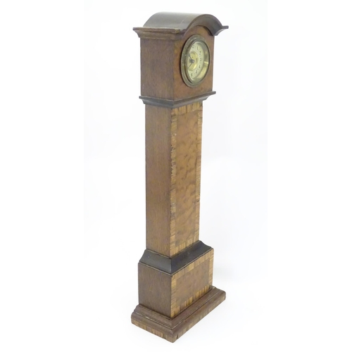 1396 - A mantle clock formed as a miniature long case / grandfather clock. Approx. 16 1/2