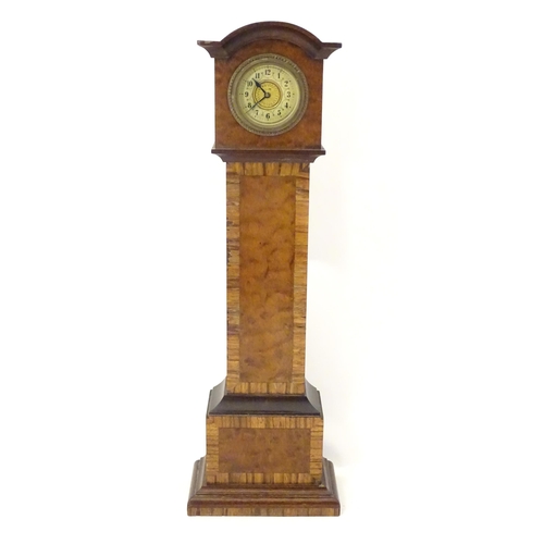 1396 - A mantle clock formed as a miniature long case / grandfather clock. Approx. 16 1/2