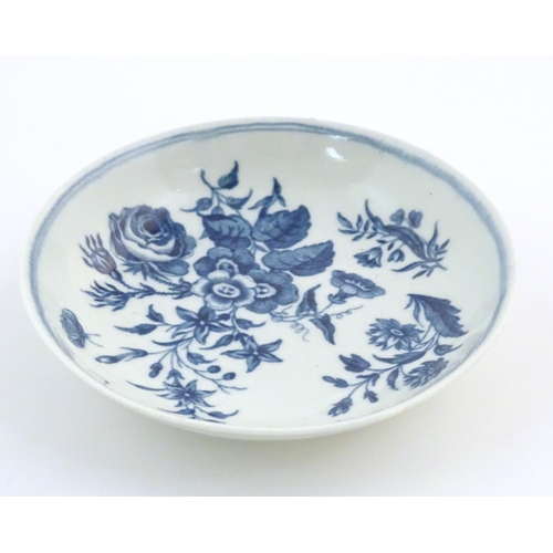 74 - A Worcester blue and white saucer decorated with flowers, foliage and butterflies. Crescent moon mar... 