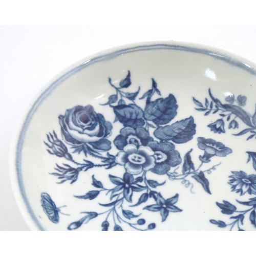 74 - A Worcester blue and white saucer decorated with flowers, foliage and butterflies. Crescent moon mar... 