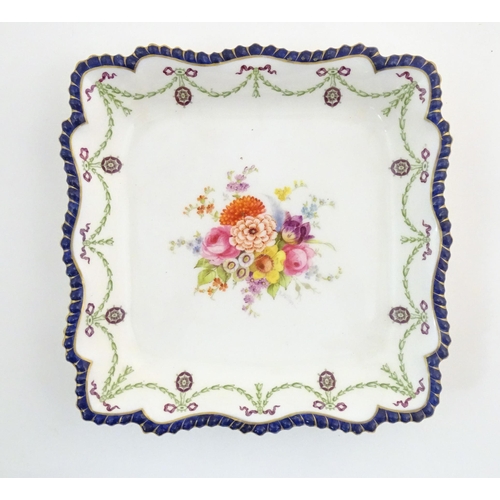 76 - A Royal Worcester dish of squared form with central floral decoration to centre and swag border. Mar... 