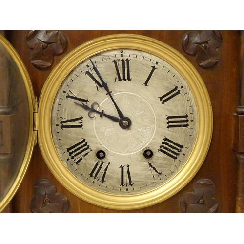 1398 - A Victorian Gothic revival mantle clock the architectural formed case with twin columns, trefoil det... 