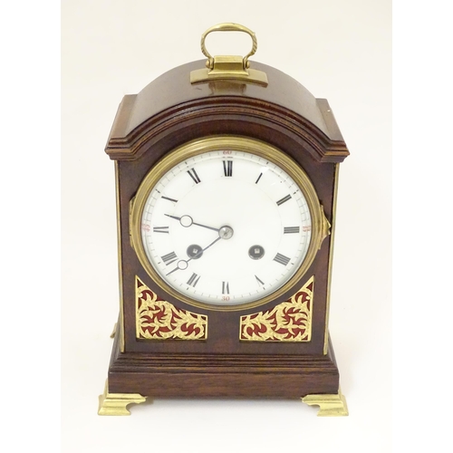 1406 - A 20thC small proportion mahogany bracket clock, in the Regency style, with white enamel dial and 8-... 