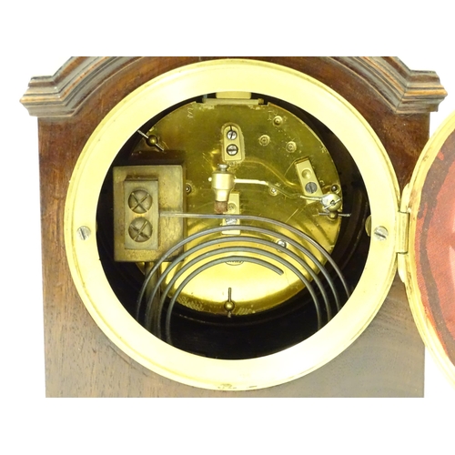 1406 - A 20thC small proportion mahogany bracket clock, in the Regency style, with white enamel dial and 8-... 