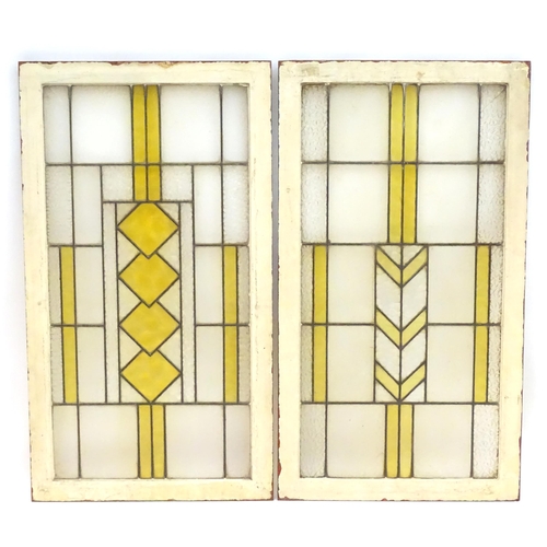 1355 - Two Art Deco stained glass window panes / panels with geometric and chevron detail. Approx. 35