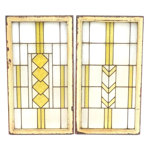 1355 - Two Art Deco stained glass window panes / panels with geometric and chevron detail. Approx. 35