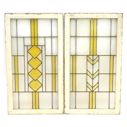 1355 - Two Art Deco stained glass window panes / panels with geometric and chevron detail. Approx. 35