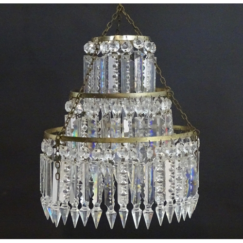 1329 - An early 20thC bag light shade, formed in three circular tiers of drop lustres in graduated diameter... 