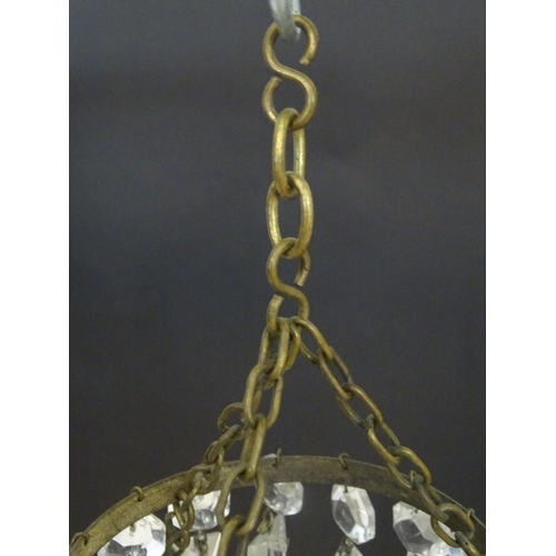 1329 - An early 20thC bag light shade, formed in three circular tiers of drop lustres in graduated diameter... 