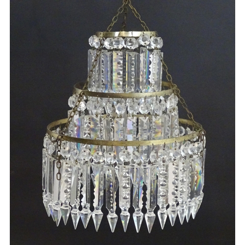 1329 - An early 20thC bag light shade, formed in three circular tiers of drop lustres in graduated diameter... 