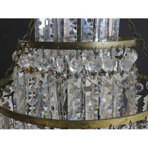 1329 - An early 20thC bag light shade, formed in three circular tiers of drop lustres in graduated diameter... 