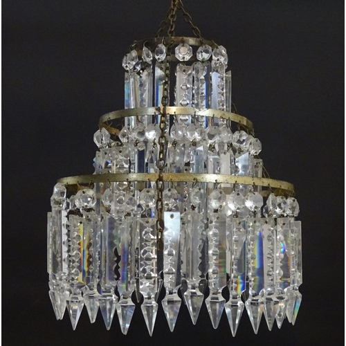 1329 - An early 20thC bag light shade, formed in three circular tiers of drop lustres in graduated diameter... 