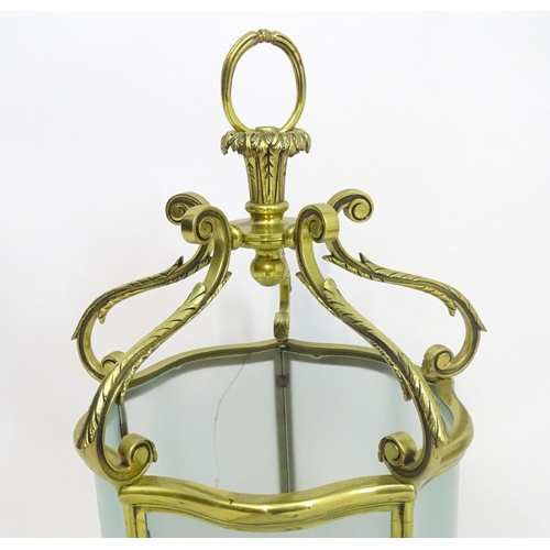 1330 - A 19thC brass hanging lantern and original bracket, the shade with five panels of frosted glass. App... 