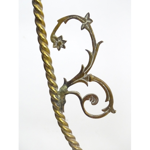 1331 - An early 20thC brass pendant light with white glass shade, the frame decorated with rope twists and ... 