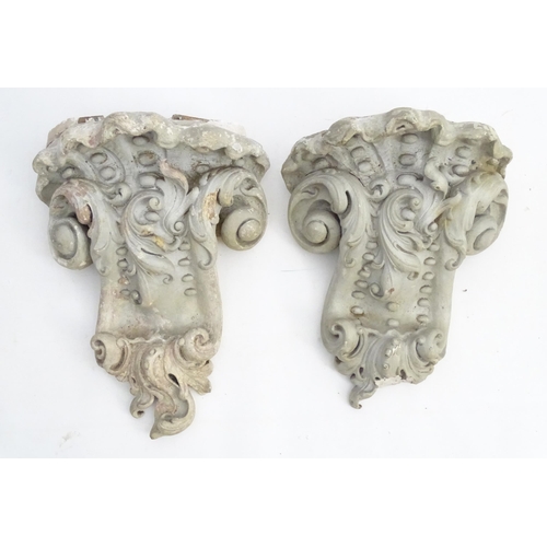 1353 - Garden & Architectural, Salvage: a pair of reconstituted stone brackets decorated with scrolling flo... 