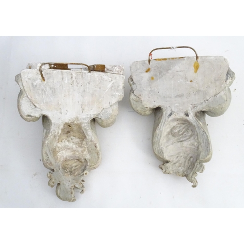 1353 - Garden & Architectural, Salvage: a pair of reconstituted stone brackets decorated with scrolling flo... 