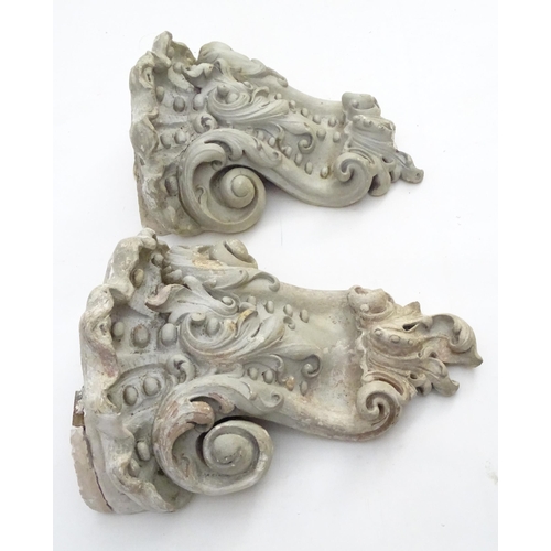 1353 - Garden & Architectural, Salvage: a pair of reconstituted stone brackets decorated with scrolling flo... 