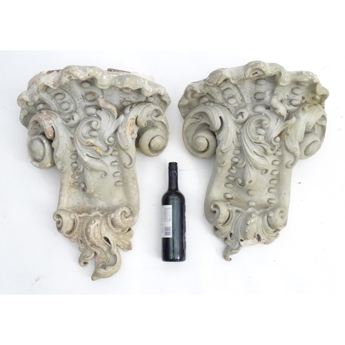 1353 - Garden & Architectural, Salvage: a pair of reconstituted stone brackets decorated with scrolling flo... 