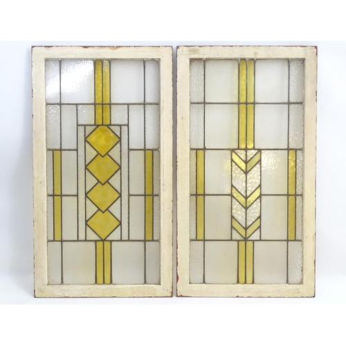 1355 - Two Art Deco stained glass window panes / panels with geometric and chevron detail. Approx. 35