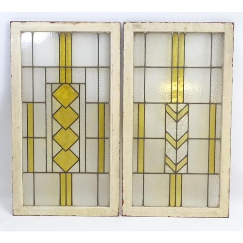 1355 - Two Art Deco stained glass window panes / panels with geometric and chevron detail. Approx. 35