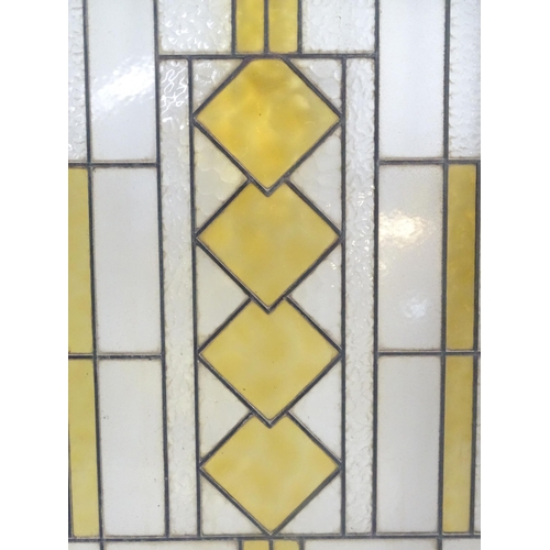 1355 - Two Art Deco stained glass window panes / panels with geometric and chevron detail. Approx. 35