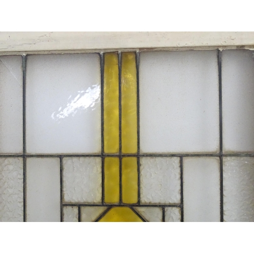 1355 - Two Art Deco stained glass window panes / panels with geometric and chevron detail. Approx. 35