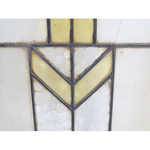 1355 - Two Art Deco stained glass window panes / panels with geometric and chevron detail. Approx. 35