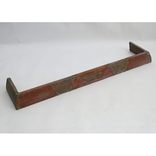 1360 - An early 20thC kerb fender, of copper construction with sectional decoration, approximately 50