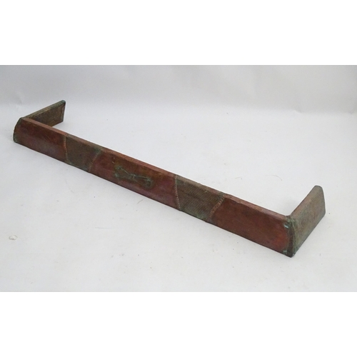 1360 - An early 20thC kerb fender, of copper construction with sectional decoration, approximately 50