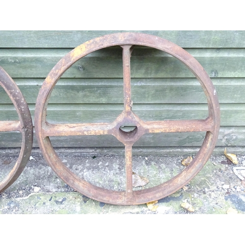 1363 - A set of four Victorian cast iron shepherd's hut wheels, each approximately 25