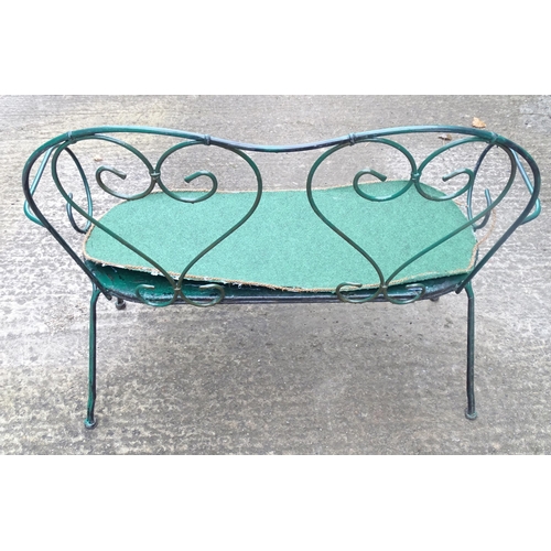 1364 - A two-seater garden bench, of wrought metal construction with two hearts forming the splat, green pa... 