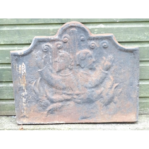 1366 - A 19thC continental cast iron fireback, decorated with opposing figures and with a raised border. Ap... 