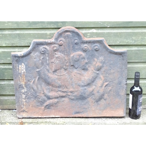 1366 - A 19thC continental cast iron fireback, decorated with opposing figures and with a raised border. Ap... 