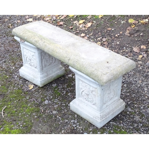 1372 - A late 20thC reconstituted stone garden bench, consisting of two pedestals supporting a rectangular ... 