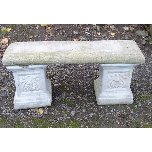 1372 - A late 20thC reconstituted stone garden bench, consisting of two pedestals supporting a rectangular ... 