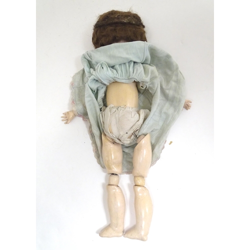 1298 - Toy: an early 20thC bisque doll by Herman Steiner , Bavaria. The head with back stamps: 'Made in Ger... 