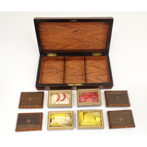 1302 - A 19thC rosewood games box, the lid decorated with playing card suits opening two reveal a fitted in... 